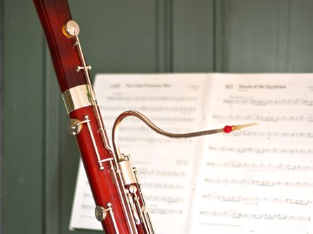 A second hand bassoon in front of sheet music at Double Reed Ltd.
